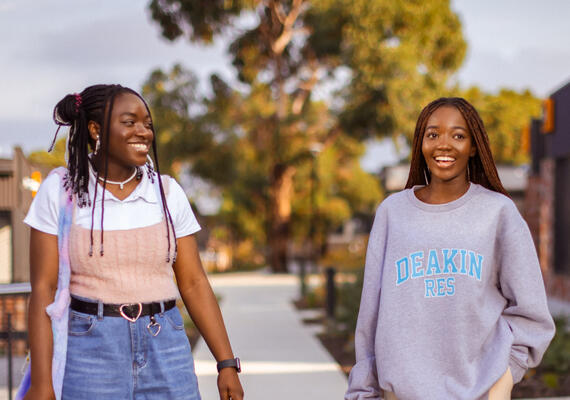 Two Geelong Waurn Ponds residents walk through campus