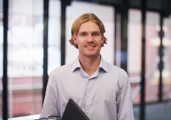 Profile shot of Bachelor of Commerce graduate Kai Crosby.