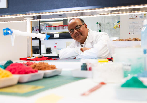 A scientist works in a lab.