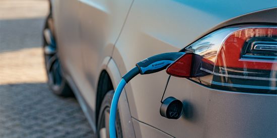 Electric car charging at a station