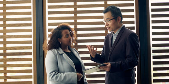 Two staff at Deakin Law School having a discussion