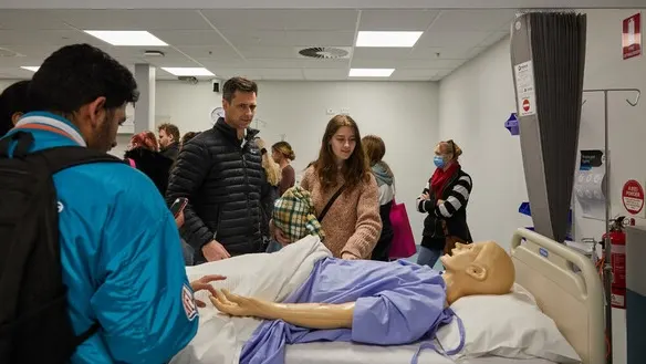Future students at Deakin Open Day interacting with the nursing learning spaces.