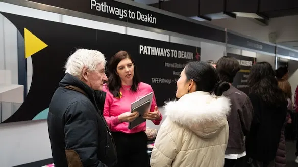 Students talking with staff at Deakin Open Day.