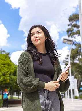 A female student standing outside at Deakin Burwood campus