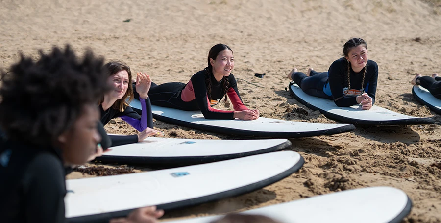 Summer School students learning to surf during Surf Day at Torquay Beach.