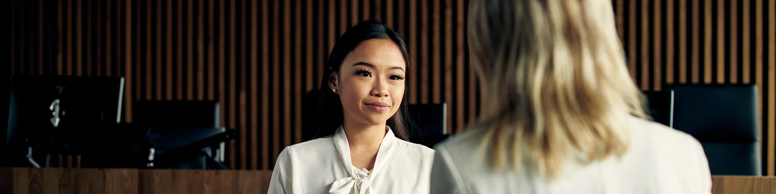Two Deakin Juris Doctor students chat. 