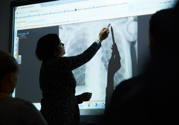 A person presents an x-ray.