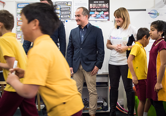 Adults and children in a school classroom