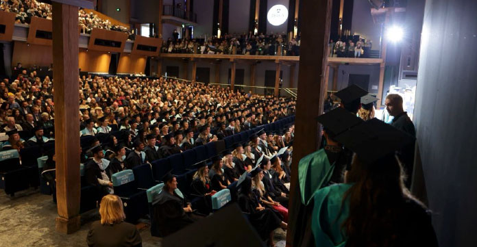 Image of theatre seating full of graduates