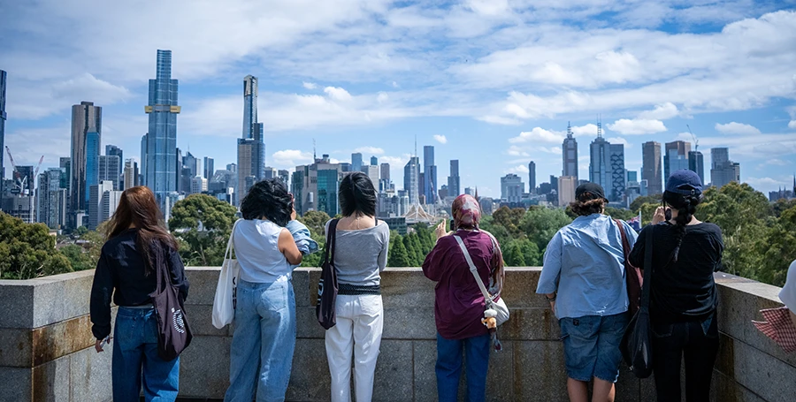 Summer School students overlooking Melbourne's city skyline during a guided excursion.