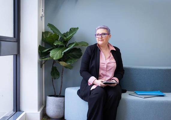 Seated woman in office environment