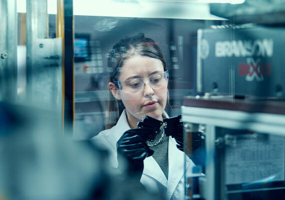 Scientist analysing battery prototype