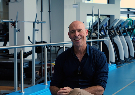 Deakin exercise and sport science expert talks in campus gym.
