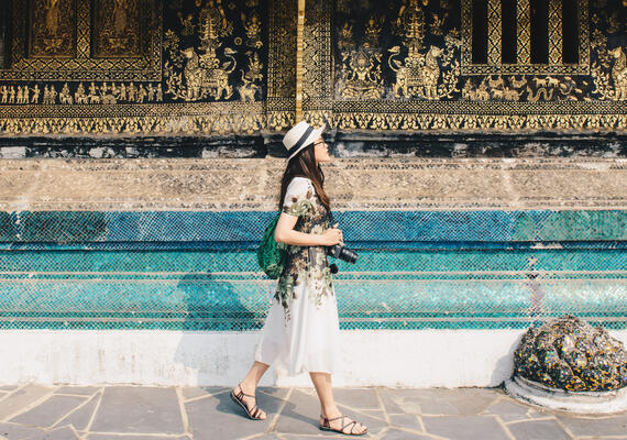 A Deakin Arts student walks near a temple whilst studying abroad