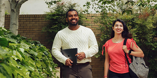 Two students walking on Deakin Waurn Ponds campus