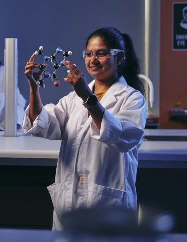 Students studying molecular models.