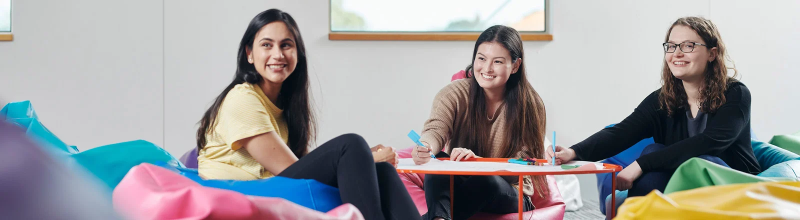 Public Health and Health Promotion students smile while working together