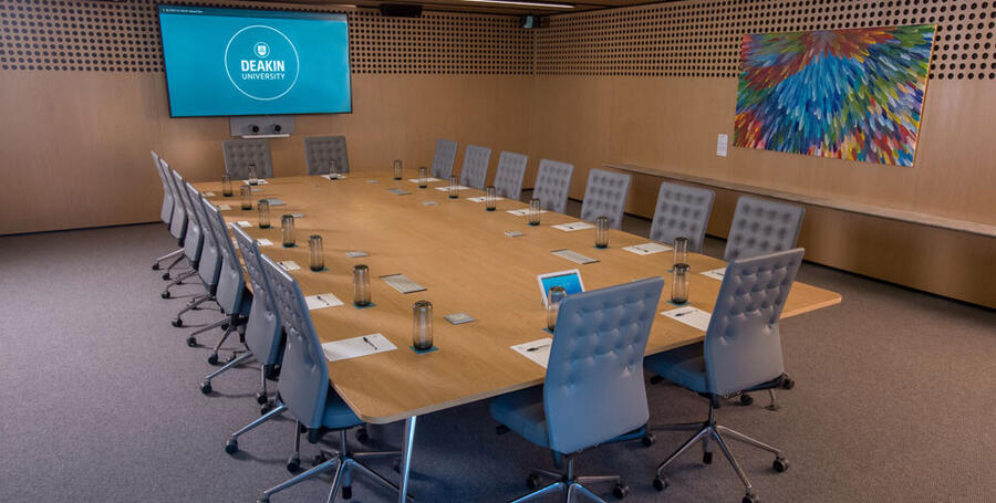 Medium size meeting room with large desk at the centre at Melbourne Downtown Corporate Centre.
