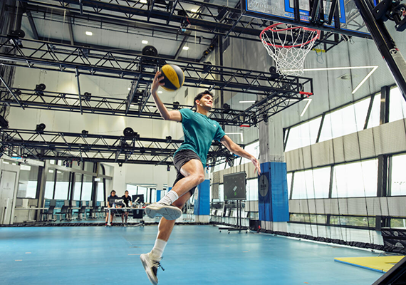 A person playing sport inside at the Deakin Centre for Sport Research