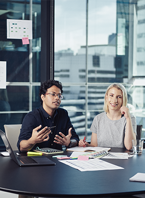 Two Deakin commerce students in a classroom