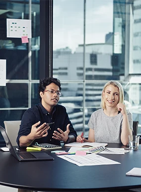 Two Deakin commerce students in a classroom