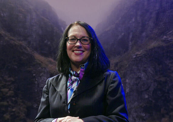 still from video that features Professor Toija Cinque in an exhibition space. 