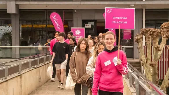 A Deakin student leading a campus tour at Open Day.
