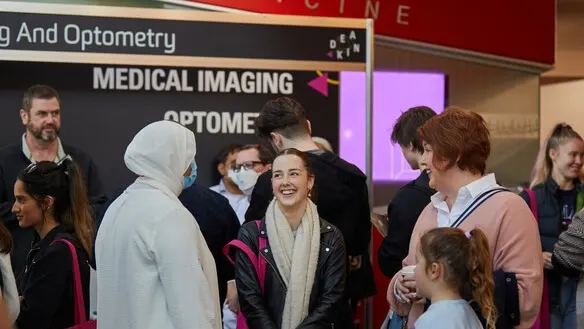 A family of future students talking to expert staff at Open Day.