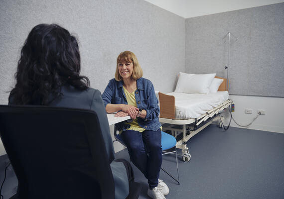A patient and a healthcare professional in a consultation.