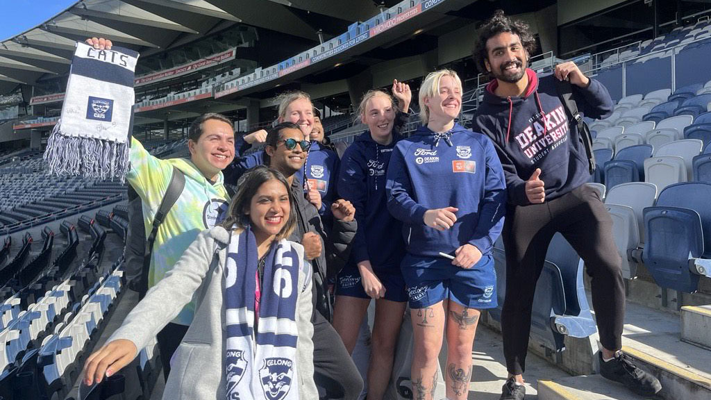 Deakin students enjoying the Geelong Cats AFL clinic