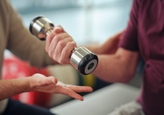 person using dumbells 