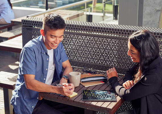 Two students talking outside at Waurn Ponds Campus.