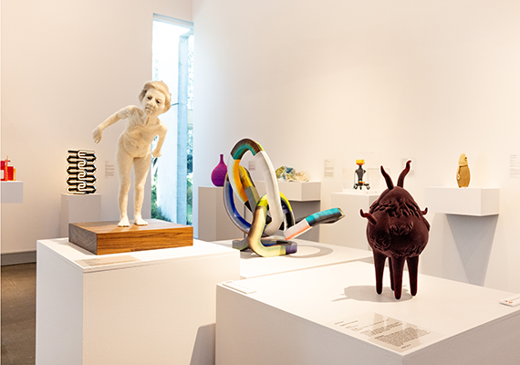 White room filled with sculptures