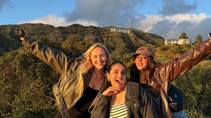 Tia and friends in front of the Hollywood sign