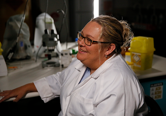 Deakin researcher Michelle Harvey in a lab coat