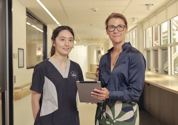 Nursing student and staff in hallway