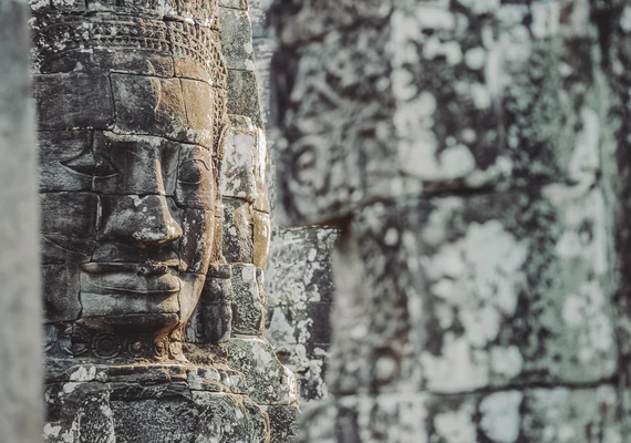 Stone Buddha face statue in Angkor Wat, Cambodia.