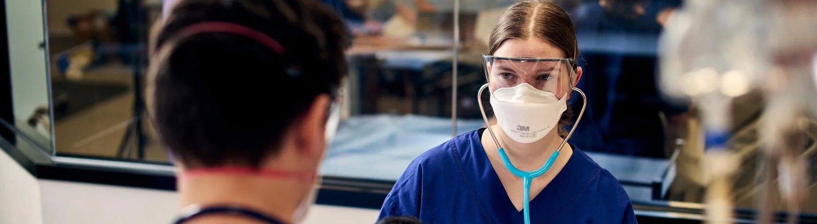 Two postgraduate Deakin nursing students in PPE.