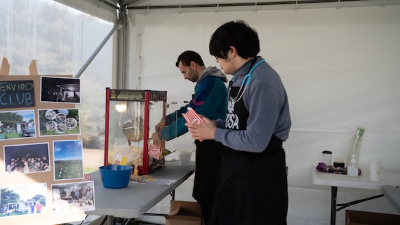 Deakin volunteers making popcorn for one of the club stands at Open Day.