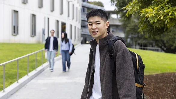 A student standing outside at Deakin Burwood