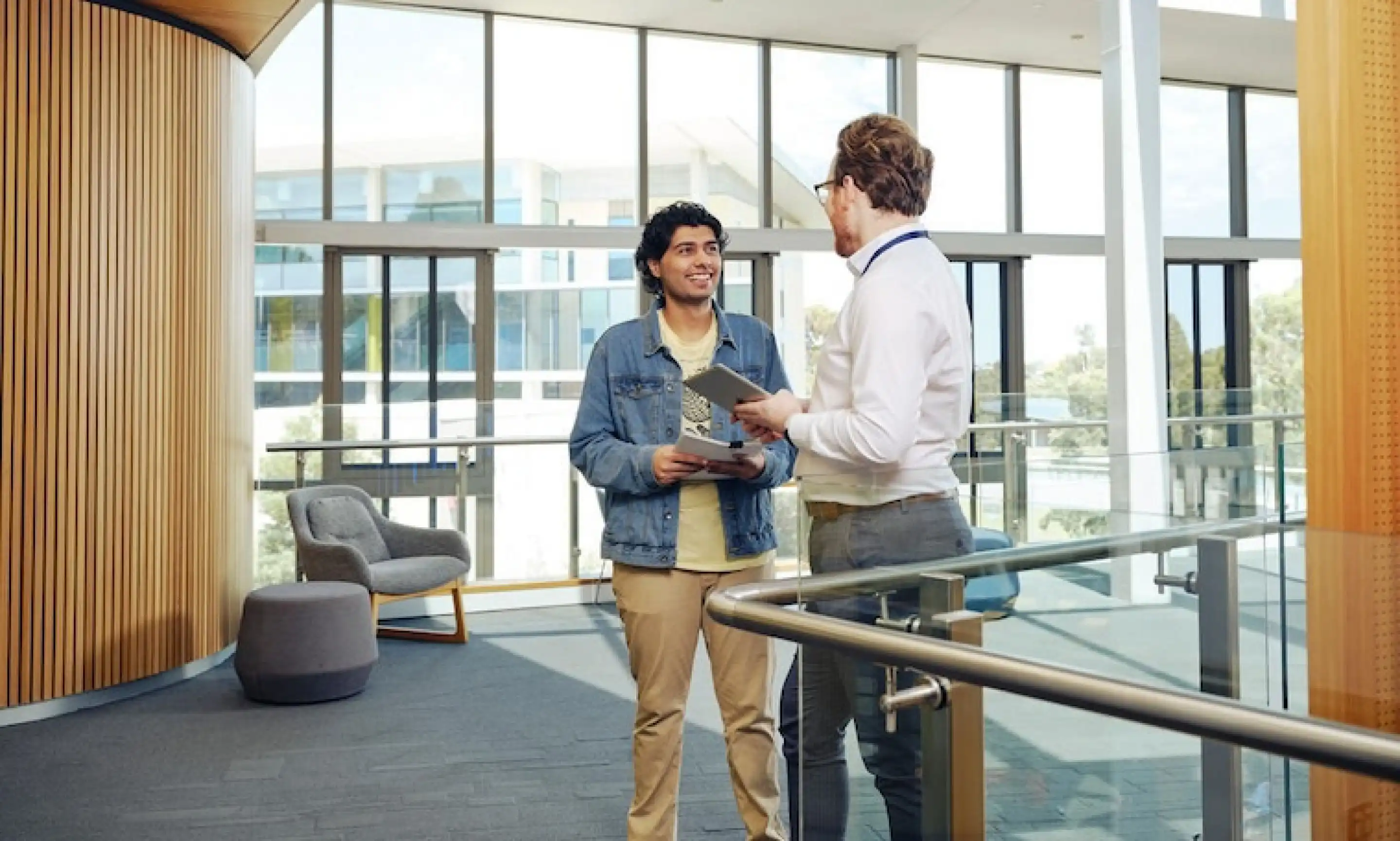 Two students standing and chatting