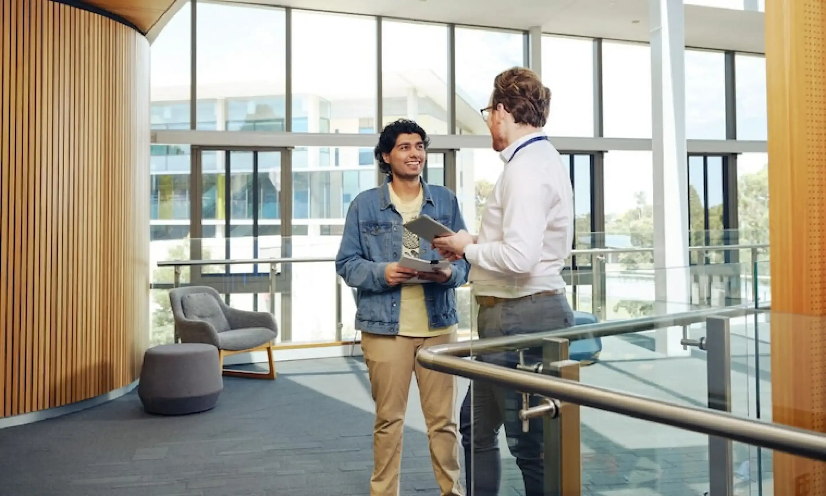 Two students standing and chatting