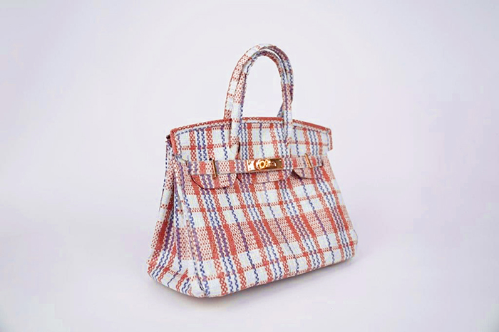 2022_Small_Sculpture_Award.jpg A sculpture of a red and white checked purse