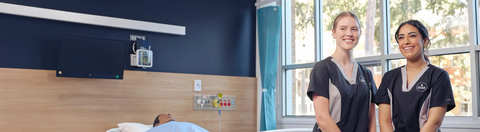 Nusring students in hospital ward.