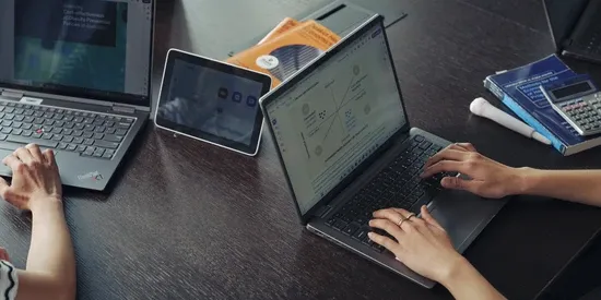 Close-up of a desk with a laptop open