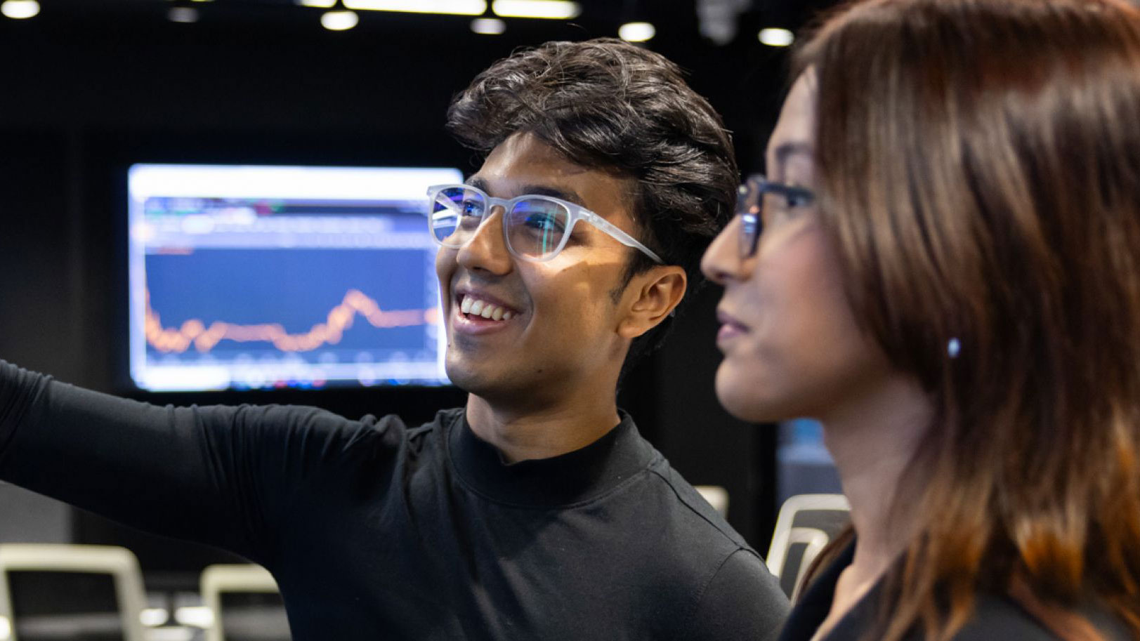 A student pointing at a screen