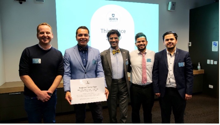 Group of 6 people smiling with certificate